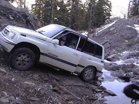 1985 Ford Bronco - We continue on our way. Chris F gets hung up with no where to go. I opted to use the new winch for the first time to pull him out.