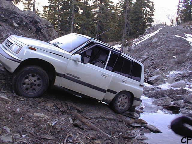 We continue on our way. Chris F gets hung up with no where to go. I opted to use the new winch for the first time to pull him out.