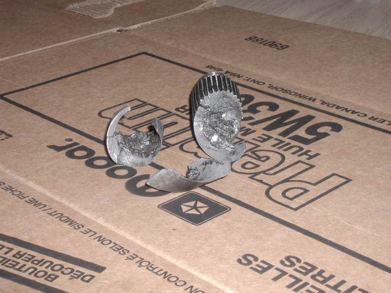 Broken metal object on a Mopar 5W30 oil box