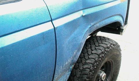 1985 Ford Bronco - Rubbed the right front fender on a tree.