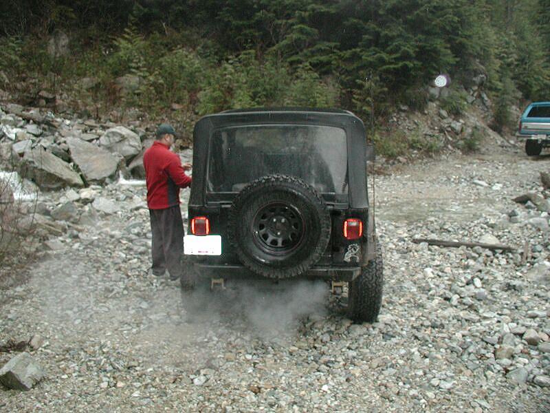 Ed cleaning the muck of his window.