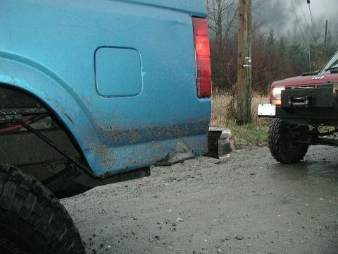 1985 Ford Bronco - Hit the left rear rocker on a log pile.