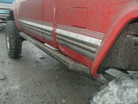 1985 Ford Bronco - A tree branch wedged between Doug's left rocker and slider.