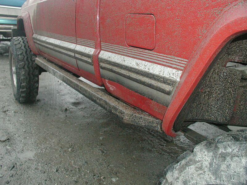 A tree branch wedged between Doug's left rocker and slider.