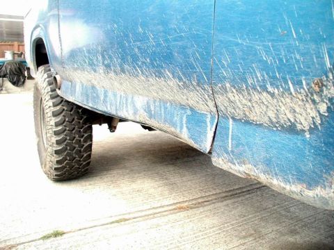 1985 Ford Bronco - Slid off a rock and hit the right rocker.