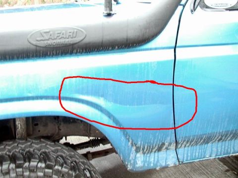 1985 Ford Bronco - Tree ding on the left front fender.