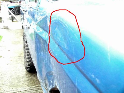 1985 Ford Bronco - Tree ding on the right front fender.