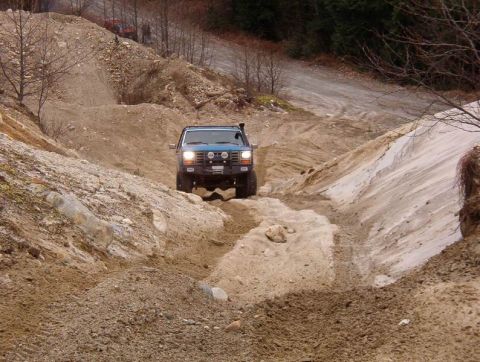 1985 Ford Bronco - Playing in a sand/gravel pit.