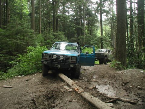 1985 Ford Bronco - This was a little side chute off the power-line trail. My rear shock mount grabbed this log, and wouldn't let me go.