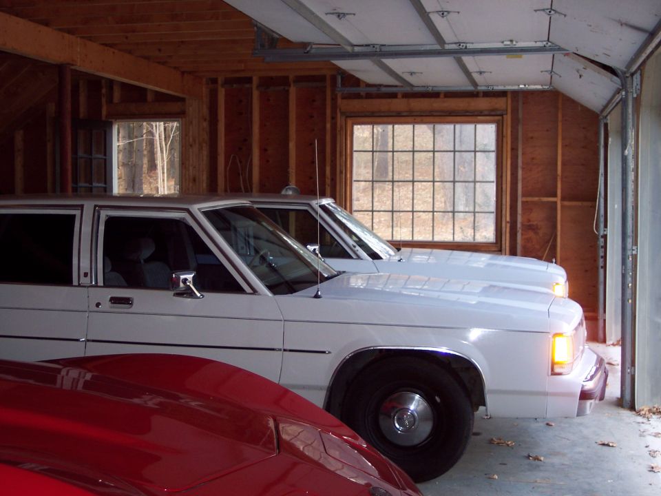 White 2001 Ford Crown Victoria parked in garage, 3q-front view