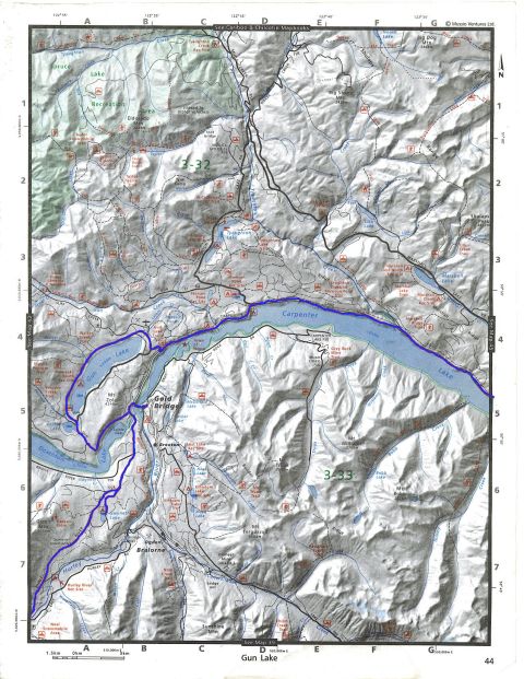 Topographic map showing lakes, rivers, mountains, and trails in a wilderness area.