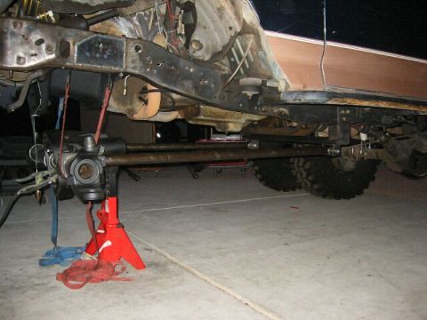 1994 Ford Bronco - Underbody view of a 1994 Ford Bronco, showing suspension and steering parts while on jack stands.