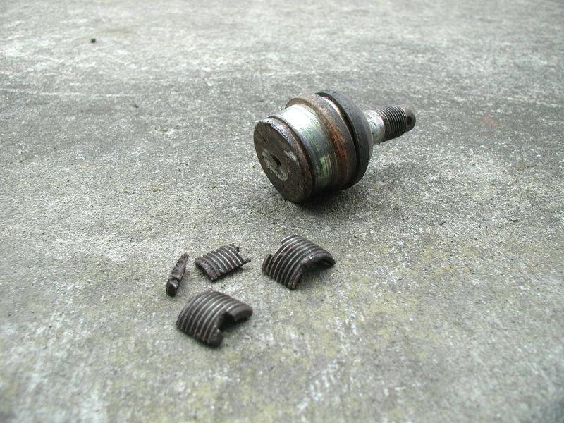 The impact pushed the the upper ball joint up, about 1/16". I drove on it like this for the rest of the day. Upon changing the ball joint, I found the pre-load collar was broken in four pieces.