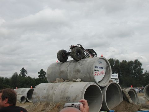 Remote-controlled rock crawler on concrete pipes.