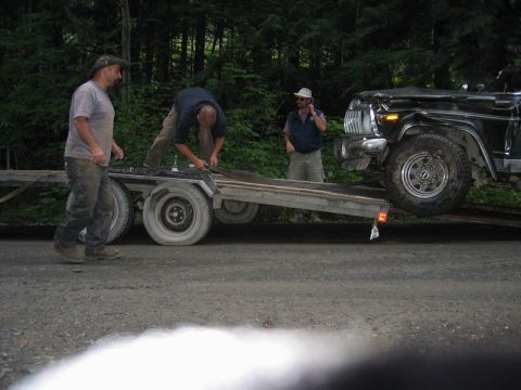1985 Ford Bronco - I got in position and we snatched off the front of the trailer and winched him up.