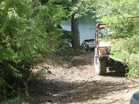 1985 Ford Bronco - She wasn't moving any further as we were pulling into the bank, so we anchored the Jeep to the tree and re-assessed the situation.
