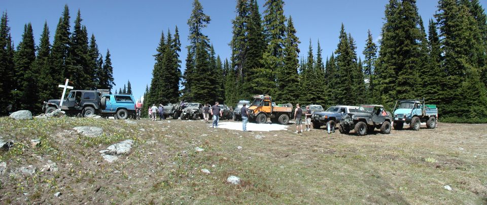We continued on, and after about 30 minutes, we caught up to the rest of the group at Dick's Cabin (6190'), where they were having lunch and enjoying the scenery. The cabin is used mostly by snowmobilers in the winter, and there are also two tombstones overlooking the rolling terrain: