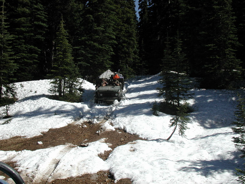 A short ways down the trail, we found that deep snow; 12" plus in some spots. Sassan plowed through with Kevin behind him. I let Ryan and his Mog go ahead to help out wit breaking trail: