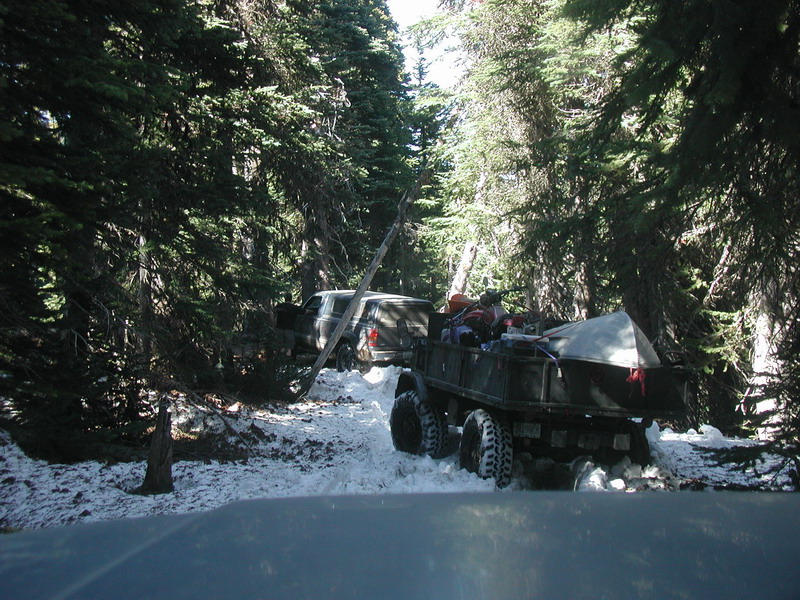 A short ways down the trail, we found that deep snow; 12" plus in some spots. Sassan plowed through with Kevin behind him. I let Ryan and his Mog go ahead to help out wit breaking trail: