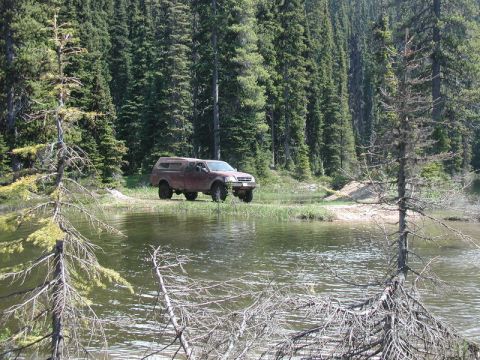 1985 Ford Bronco - The rest of the group rolled in about 10 minutes later, as Tim was towing Mike's front wheel drive only CJ through the hard stuff: