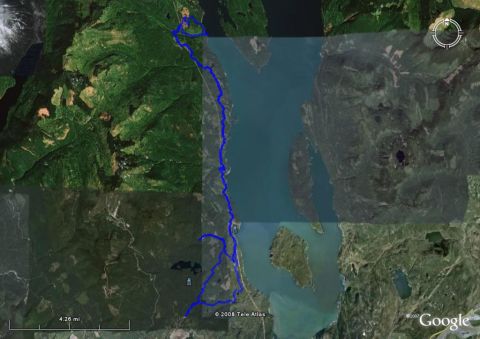 1985 Ford Bronco - This is a satellite image showing a blue line overlaid on a landscape, likely representing a trail or route. The image displays a body of w…