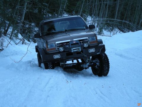 1985 Ford Bronco - We turned off on a side road that had snowmobile tracks and was farely hard packed.....in the middle.