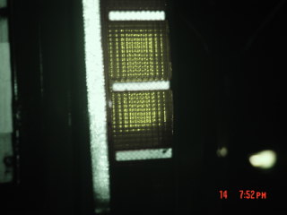 1985 Ford Bronco - This image shows a close-up of a vehicle's tail light assembly, the SUPERMOTORS.NET watermark.