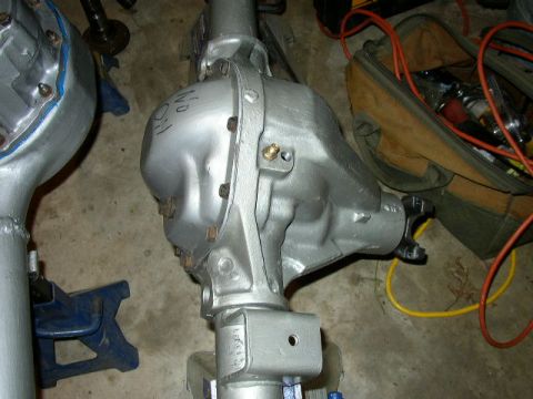 1995 Ford Bronco - Differential housing shown in a garage setting with tools nearby.