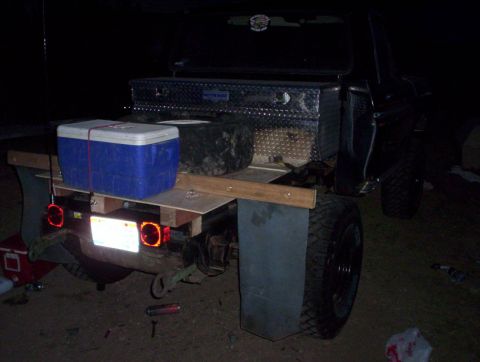 1978 Ford Bronco - Rear view of a truck bed modified with a flatbed, cooler, and toolbox.