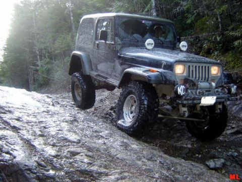 Jeep Wrangler off-roading on a rocky trail