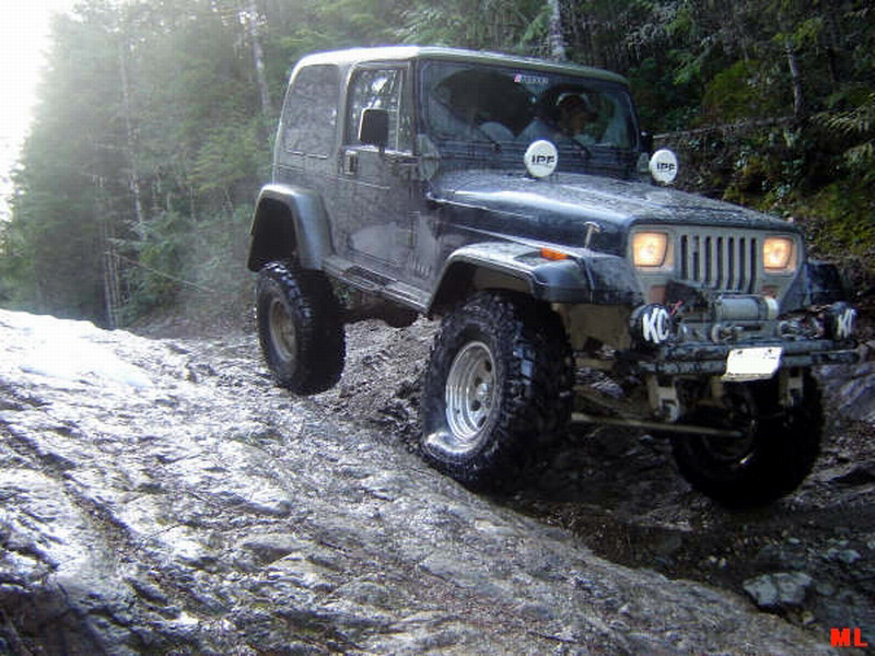 Jeep Wrangler off-roading on a rocky trail