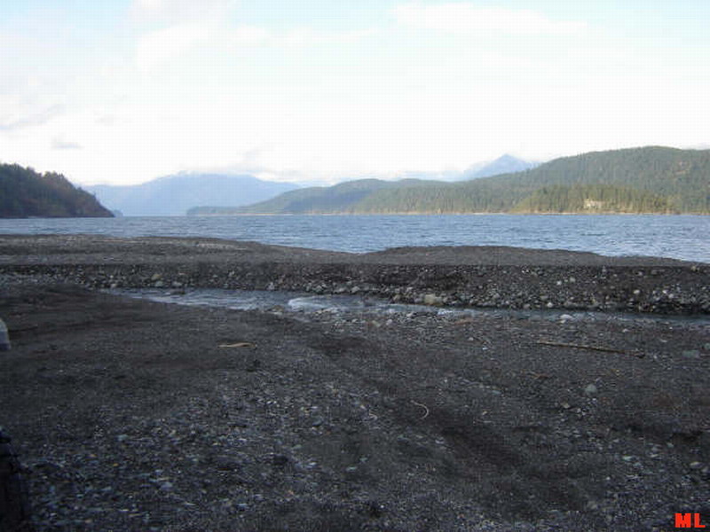 Lake with mountains and rocky shore