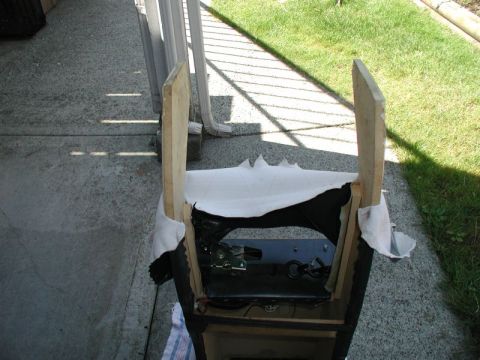 1990 Ford F-250 - This image shows a partially constructed wooden frame covered with white fabric, revealing some internal mechanical components. The scene i…