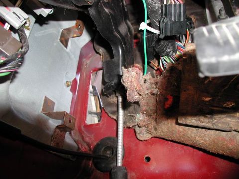 1990 Ford F-250 - This image shows the interior of a vehicle, focusing on the driver's side footwell area. Visible components include the brake pedal assembl…