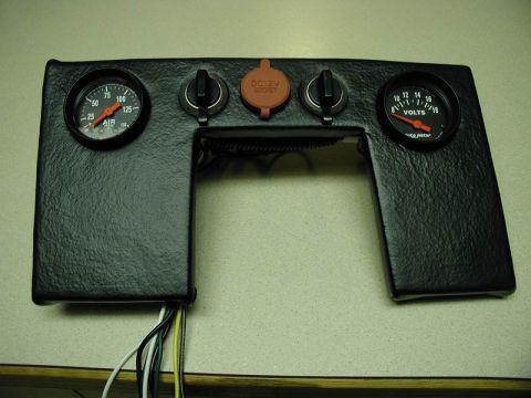 1990 Ford F-250 - A black custom dashboard panel with two gauges, a DC 12V socket, and two switches is mounted on a light-colored surface. Wires are visible…