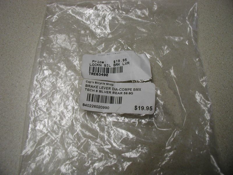 Plastic bag with two product labels for bicycle brake levers.