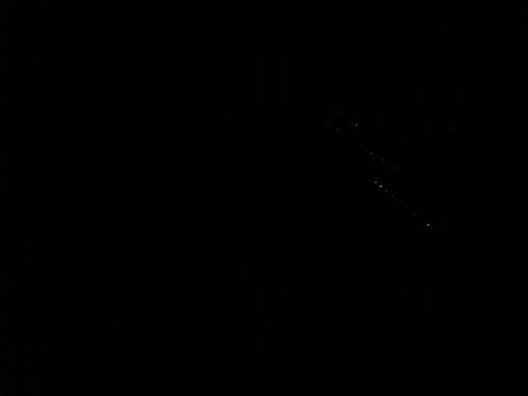 1990 Ford F-250 - The image is completely black with a few faint, scattered white and yellow lights visible in the upper right quadrant. It is unclear what t…