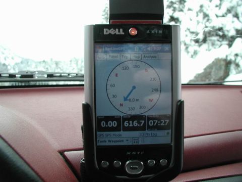 1990 Ford F-250 - A Dell Axim X51v GPS device is mounted on the dashboard of a vehicle, displaying navigation data. The device is positioned in front of a sn…