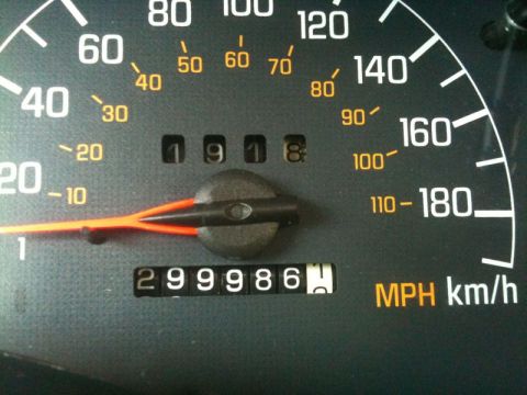 2002 Pontiac Grand Prix - The image shows a close-up of a car's dashboard, focusing on the speedometer and odometer. The odometer reads 299986, and the speedometer n…