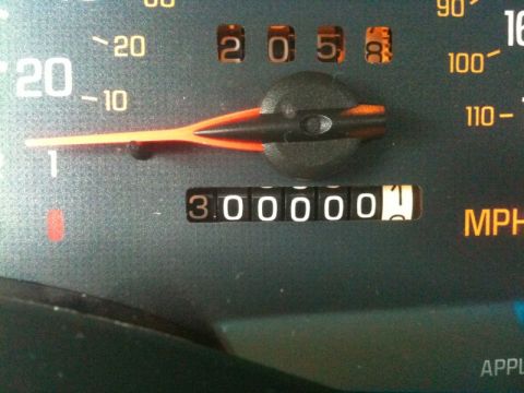 2002 Pontiac Grand Prix - A close-up shot of a car's odometer displaying 300,000 miles. The speedometer needle is pointing slightly above the 20 MPH mark.