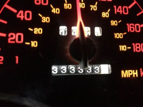 2002 Pontiac Grand Prix - A close-up shot of a car's dashboard shows a speedometer with a needle pointing between 40 and 50 MPH. The odometer displays 333333.