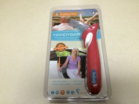 2002 Pontiac Grand Prix - The image shows a red Handybar car assist device in its retail packaging. The packaging features images of people using the device to get i…
