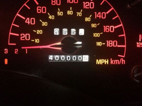 2002 Pontiac Grand Prix - The odometer of a 2002 Pontiac Grand Prix reads 400,005 miles. The speedometer is illuminated red and shows the needle near the 20 MPH mark.
