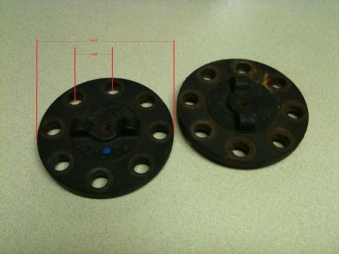 2002 Pontiac Grand Prix - Two black circular metal flanges with multiple bolt holes are shown. One flange has red measurement lines indicating a 4 1/2" overall diame…