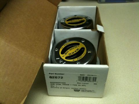 2002 Pontiac Grand Prix - A box containing two Warn locking hubs, part number 62672, for a 1 ton 35 spline application. The box also shows a date of 03/28/11 and cou…