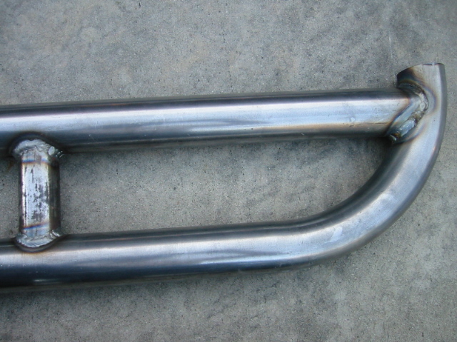 Bare steel welded tubular bumper corner on concrete