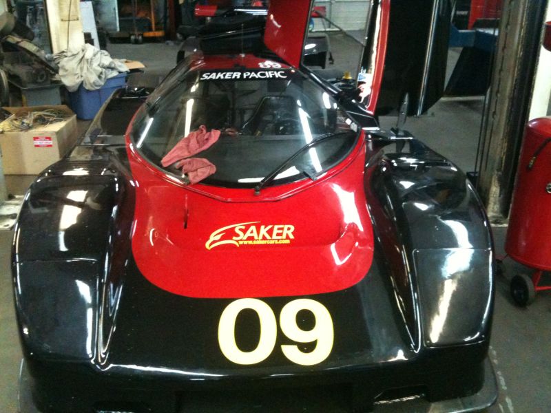 Front view of a black and red Saker Pacific race car with number 09.