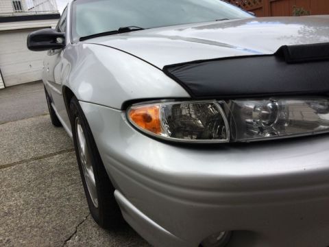 2002 Pontiac Grand Prix - Aftermarket headlight housings, stock brackets and aftermarket clear corners. Sag same as clear corners.