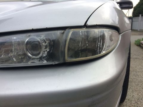 2002 Pontiac Grand Prix - The left corner had a broken mount, so I used some plastic adhesive and metal strips to fix it. I moved the mounting hole inward and forwar…