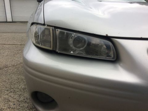 2002 Pontiac Grand Prix - The left corner had a broken mount, so I used some plastic adhesive and metal strips to fix it. I moved the mounting hole inward and forwar…